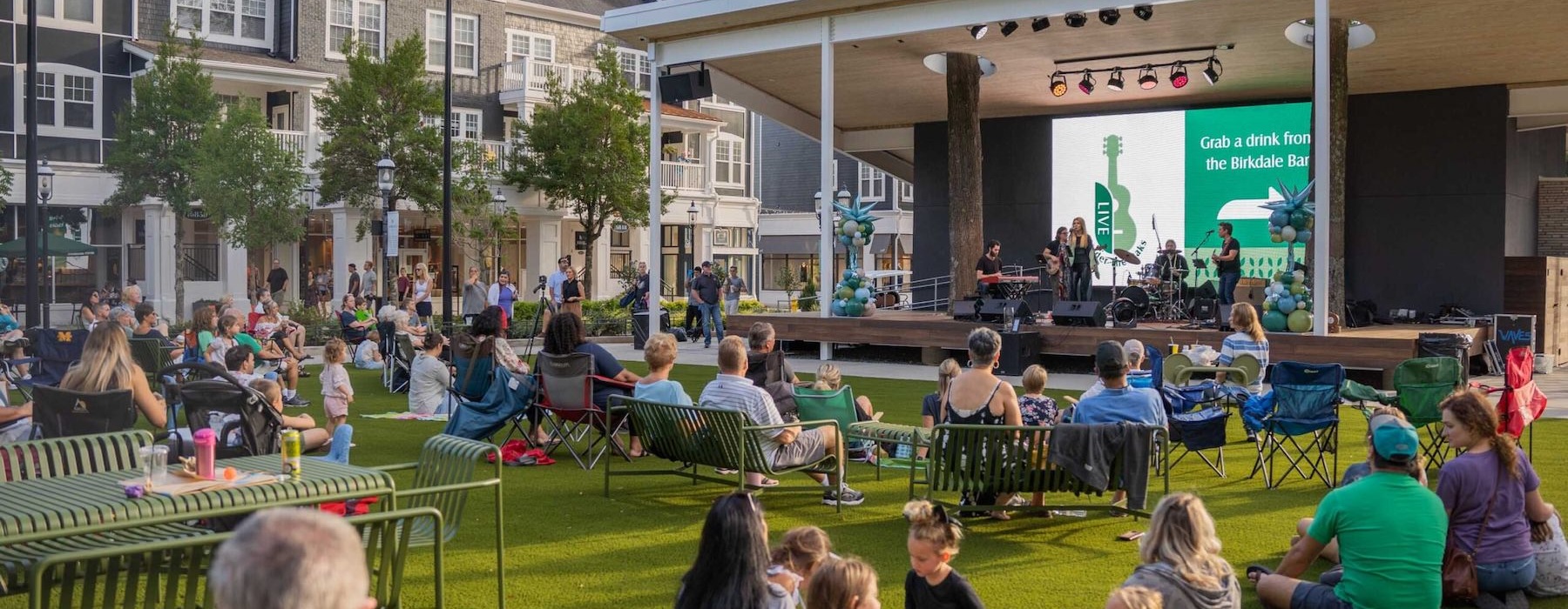 a group of people sitting outside