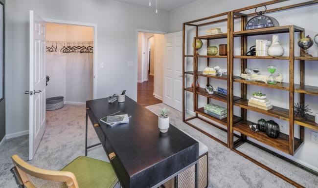 a room with a table and shelves